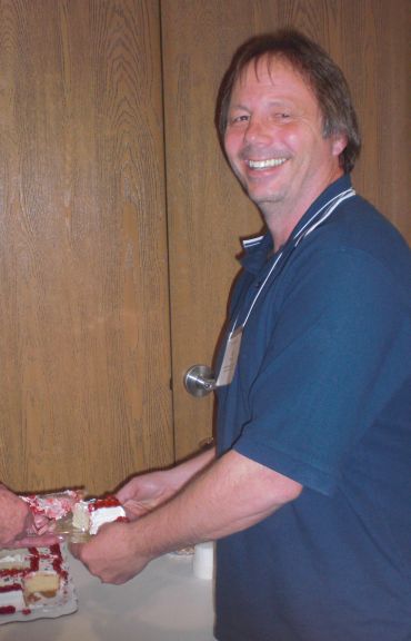 Jessee Farris receiving the first piece of cake